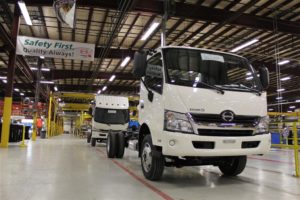 two trucks on assembly line